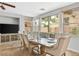 Dining room features a decorative table setting and large windows at 1080 Via Saint Lucia Pl, Henderson, NV 89011