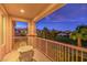 Relaxing balcony with wrought iron furniture, overlooking lush landscaping and green fairways at 11342 Winter Cottage Pl, Las Vegas, NV 89135