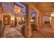 Private courtyard features covered walkway, brick paving and mature landscaping at 11342 Winter Cottage Pl, Las Vegas, NV 89135