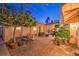 Outdoor patio features brick paving, lounge chairs and a fire pit at 11342 Winter Cottage Pl, Las Vegas, NV 89135
