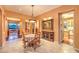 Charming dining area features a decorative light fixture and tile flooring at 11342 Winter Cottage Pl, Las Vegas, NV 89135