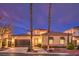 Charming home featuring desert landscaping, covered windows, and a two car garage at 11342 Winter Cottage Pl, Las Vegas, NV 89135