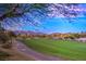 Scenic view of the golf course with mountains in the background at 11342 Winter Cottage Pl, Las Vegas, NV 89135