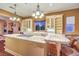 Gourmet kitchen with large central island, granite countertops, and custom cabinetry at 11342 Winter Cottage Pl, Las Vegas, NV 89135