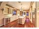 The modern kitchen features an island, stainless steel appliances, and ample counter space at 11342 Winter Cottage Pl, Las Vegas, NV 89135