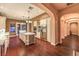 The gourmet kitchen features wood floors, stainless steel appliances, and a large island at 11342 Winter Cottage Pl, Las Vegas, NV 89135