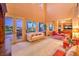 The expansive living area features high ceilings, plenty of natural light, and French doors at 11342 Winter Cottage Pl, Las Vegas, NV 89135