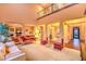 The spacious living room features high ceilings, hardwood floors, and elegant furnishings at 11342 Winter Cottage Pl, Las Vegas, NV 89135