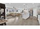 Open floor plan blending the kitchen and living room, featuring modern fixtures and a seamless design at 1206 Hopespring Loop Ave, North Las Vegas, NV 89084