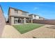 The private backyard features an artificial grass lawn and gravel landscaping at 12125 Arrebol Ave, Las Vegas, NV 89138