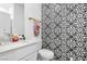 Modern bathroom features bold, patterned tile, a marble vanity, and contemporary fixtures at 12125 Arrebol Ave, Las Vegas, NV 89138