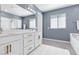Bright bathroom with double vanity, large mirror, and separate bathtub and shower at 12125 Arrebol Ave, Las Vegas, NV 89138