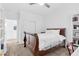 Bedroom with neutral carpet, white walls, and access to the bathroom at 12125 Arrebol Ave, Las Vegas, NV 89138