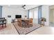 Bright dining room with sliding glass doors and stylish decor, complemented by tile flooring at 12125 Arrebol Ave, Las Vegas, NV 89138