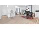 Bright living room featuring tile flooring, staircase, piano, and decor under natural light at 12125 Arrebol Ave, Las Vegas, NV 89138