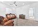 Sitting room featuring brown leather furniture, neutral walls, and carpet at 12125 Arrebol Ave, Las Vegas, NV 89138