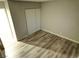 Bedroom with hardwood floors, neutral walls, and a closet with sliding doors at 1331 Crestwood Ave, Las Vegas, NV 89104