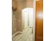 Hallway featuring neutral walls, light wood floors, white doors, and wood cabinets at 1463 Orange Jubilee Rd, Henderson, NV 89014