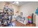 Comfortable bedroom with neutral walls, wood laminate flooring, a desk, and a cozy atmosphere, ready for personalization at 1545 Peaceful Pine St, Henderson, NV 89052