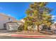 Single-story home features a well-maintained lawn and charming curb appeal, ideal for relaxed suburban living at 1545 Peaceful Pine St, Henderson, NV 89052