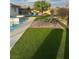 Inviting backyard with lounge chairs, manicured lawn, and a sparkling pool for ultimate relaxation at 1780 Westwind Rd, Las Vegas, NV 89146