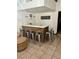 Bar with brick accents, seating for six, light countertops, and tile flooring at 1780 Westwind Rd, Las Vegas, NV 89146