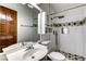 Bathroom featuring white tile, a large mirror, modern fixtures, and an enclosed shower at 1780 Westwind Rd, Las Vegas, NV 89146