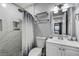 Updated bathroom featuring a marble-tiled shower, modern fixtures, and a vanity with storage at 1780 Westwind Rd, Las Vegas, NV 89146