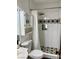 Cozy bathroom featuring a white toilet, shower with a rainfall showerhead, and tiled accents at 1780 Westwind Rd, Las Vegas, NV 89146