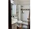 Cozy bathroom with a glass door shower, white tiles, and decorative accents at 1780 Westwind Rd, Las Vegas, NV 89146