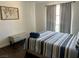 Cozy bedroom with dark floors, a window, and a comfortable bed at 1780 Westwind Rd, Las Vegas, NV 89146