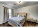 Bedroom featuring tufted headboard and natural light from the window at 1780 Westwind Rd, Las Vegas, NV 89146