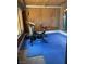 Home exercise room with bike, weight machine, and blue exercise mat at 1780 Westwind Rd, Las Vegas, NV 89146