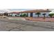 Beautiful single-story home with a well-maintained yard featuring palm trees and rock accents at 1780 Westwind Rd, Las Vegas, NV 89146