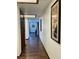 Hallway with wooden floors and a view into the room at the end at 1780 Westwind Rd, Las Vegas, NV 89146