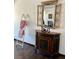 Decorated hallway with a vintage cabinet, ornamental mirror, and a decorative ladder at 1780 Westwind Rd, Las Vegas, NV 89146