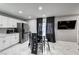 Bright kitchen with stainless steel appliances, white cabinetry, and a stylish tile backsplash at 1780 Westwind Rd, Las Vegas, NV 89146
