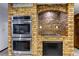 Kitchen featuring stainless steel double ovens and a brick accented cook top at 1780 Westwind Rd, Las Vegas, NV 89146