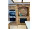 Unique kitchen with brickwork, built-in ovens, and cooktop at 1780 Westwind Rd, Las Vegas, NV 89146