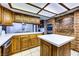 Kitchen showcasing stainless steel appliances, white countertops, and wooden cabinetry at 1780 Westwind Rd, Las Vegas, NV 89146