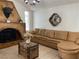 Bright living room featuring large leather sectional and a statement fireplace at 1780 Westwind Rd, Las Vegas, NV 89146