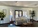 Bright living room featuring backyard access and comfortable seating at 1780 Westwind Rd, Las Vegas, NV 89146