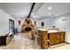 Open living room featuring a stone fireplace, wet bar and travertine floors at 1780 Westwind Rd, Las Vegas, NV 89146