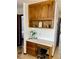 Hallway office nook with built-in desk, drawers, and overhead cabinets at 1780 Westwind Rd, Las Vegas, NV 89146