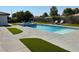 Stunning backyard with a sparkling pool, spa, and artificial turf at 1780 Westwind Rd, Las Vegas, NV 89146