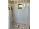 Modern shower with white square tiles, mosaic accent, and gold fixtures at 1780 Westwind Rd, Las Vegas, NV 89146