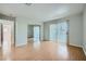 Bedroom with hardwood floors, slider to the balcony, and mirrored closet doors provide ample storage at 1810 N Decatur Blvd # 201, Las Vegas, NV 89108