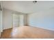 Bright bedroom with hardwood floors, natural light, and a sliding glass door that leads to a private patio at 1810 N Decatur Blvd # 201, Las Vegas, NV 89108