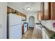 Efficient kitchen with wooden cabinets, granite countertops, and essential appliances at 1810 N Decatur Blvd # 201, Las Vegas, NV 89108