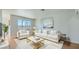 Bright living room featuring a white sofa set and modern decor accents at 1810 N Decatur Blvd # 201, Las Vegas, NV 89108
